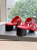 Red heeled sandals with open toe, ankle-strap, and stacked block heel