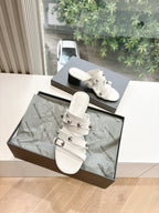 Balenciaga women's white slide sandals with buckled straps and low block heel