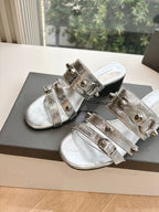 Balenciaga metallic silver sandals with two front straps and buckle hardware on low heel