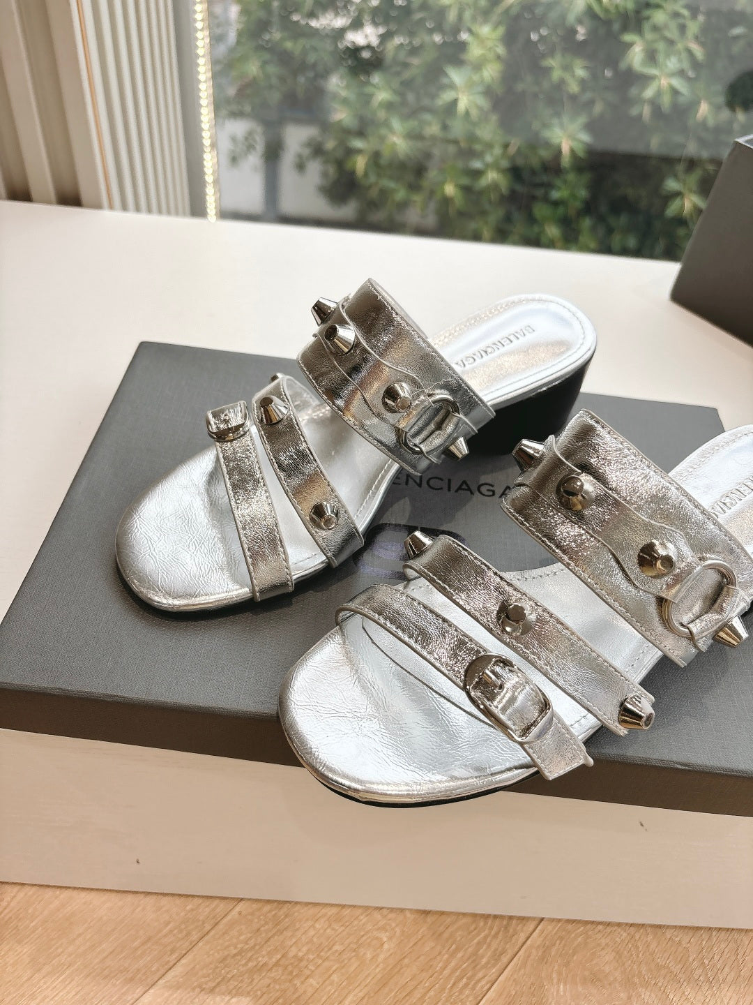 Balenciaga metallic silver sandals with two front straps and buckle hardware on low heel