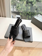 Balenciaga black slide sandals with wide strap and textured leather sole