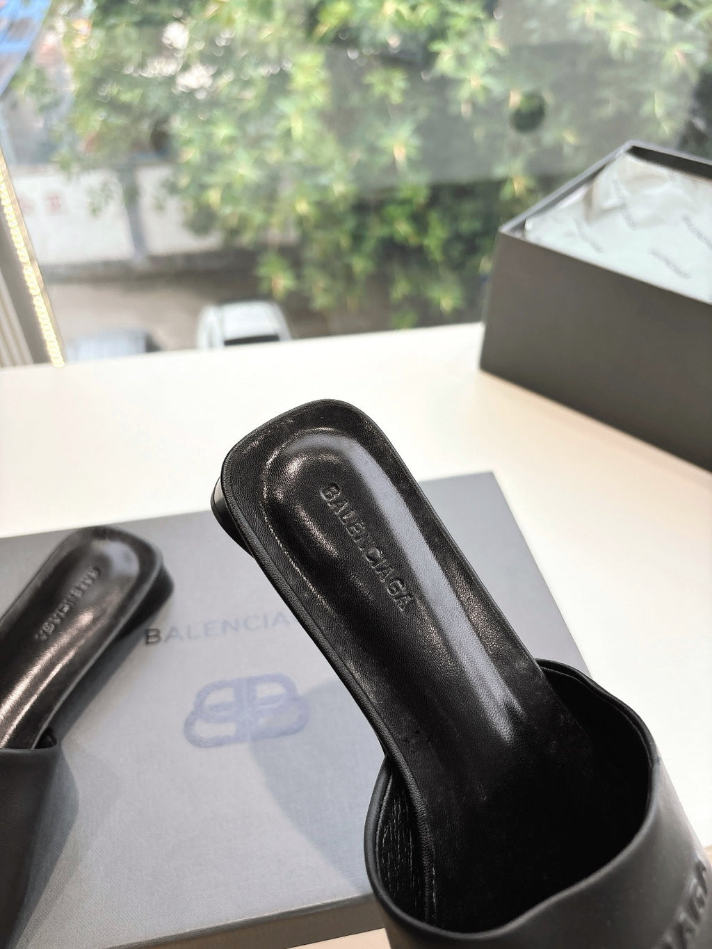Balenciaga black slide sandal upper with embossed logo detail