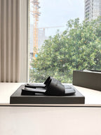 Balenciaga black slide sandal on box, wide strap and low sole