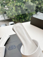 Balenciaga women's white slide sandal with 'BALENCIAGA' logo on strap