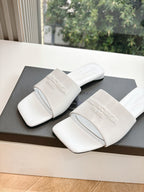Balenciaga women's white slide sandals with embossed logo on wide strap