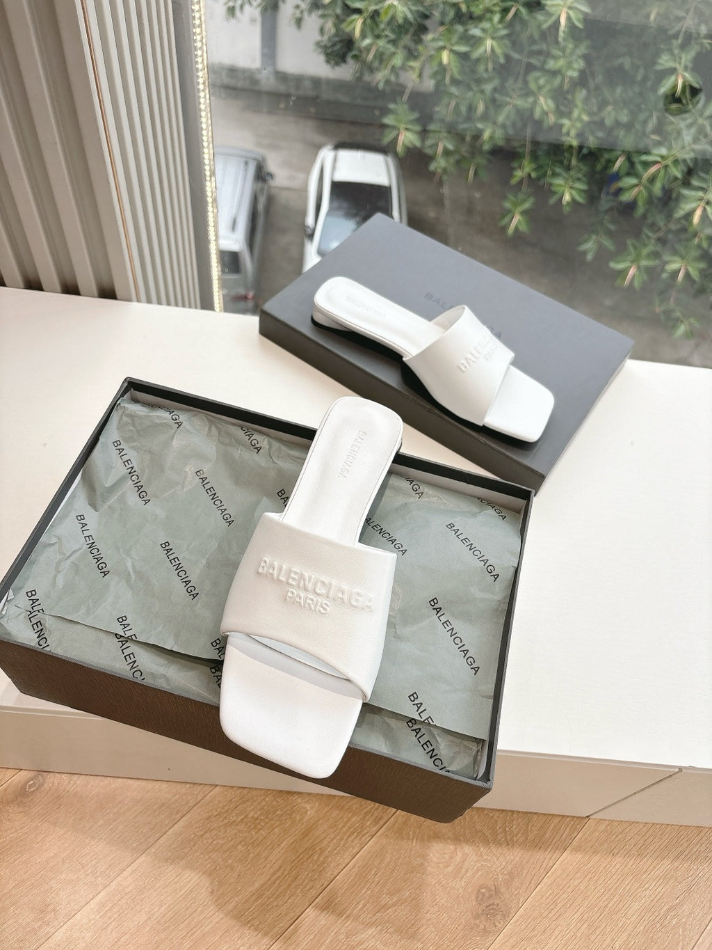 Balenciaga women's white slide sandals in open shoe box, logo embossed straps