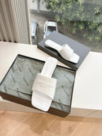Balenciaga women's white slide sandals in open shoe box, logo embossed straps
