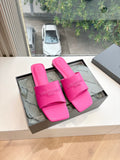 Pink Balenciaga slide sandals with wide logo straps, open toe.