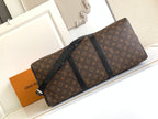 Monogram duffel bag with black leather trim and zipper closure