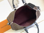 Monogram duffel bag with open top showing dark interior lining