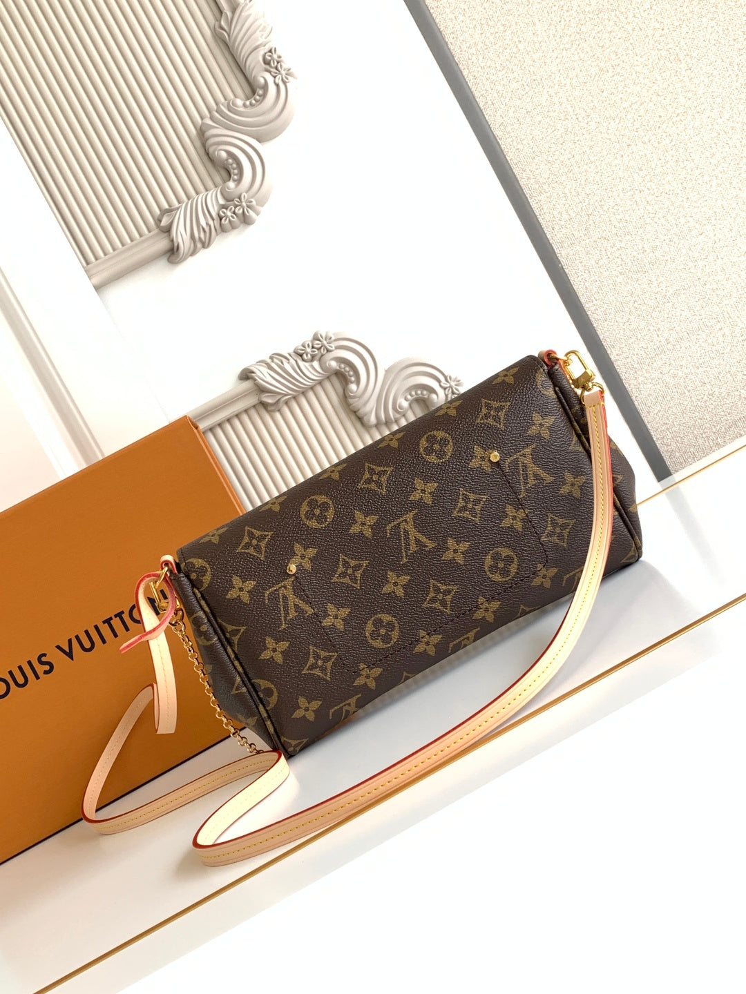 Louis Vuitton monogram shoulder bag, gold clasp, chain strap, brown canvas with light strap.