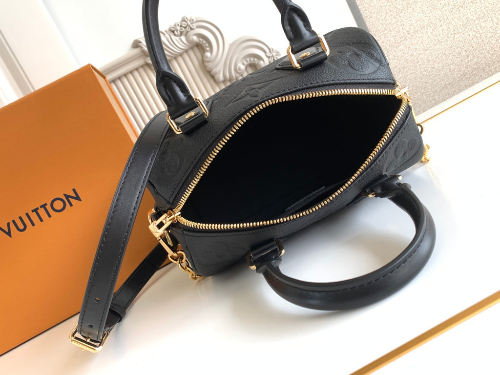 Louis Vuitton black handbag with open zip top and crossbody strap
