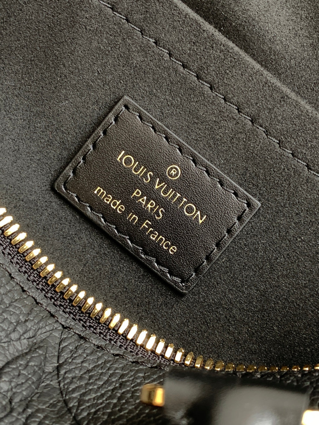 Louis Vuitton made in France authenticity tag inside black handbag