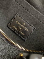 Louis Vuitton made in France authenticity tag inside black handbag