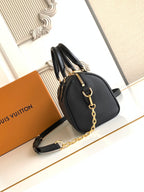 Louis Vuitton black embossed handbag with chain shoulder strap and curved handles
