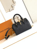 Louis Vuitton black embossed mini handbag with top handles and gold hardware
