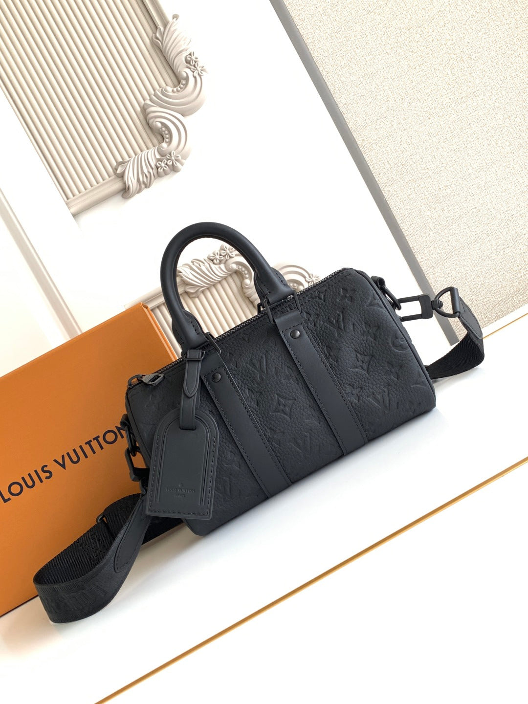 Louis Vuitton monogram tote bag, black with top handles and shoulder strap.