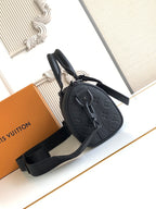 Louis Vuitton monogram crossbody bag, black with zipped top and strap.