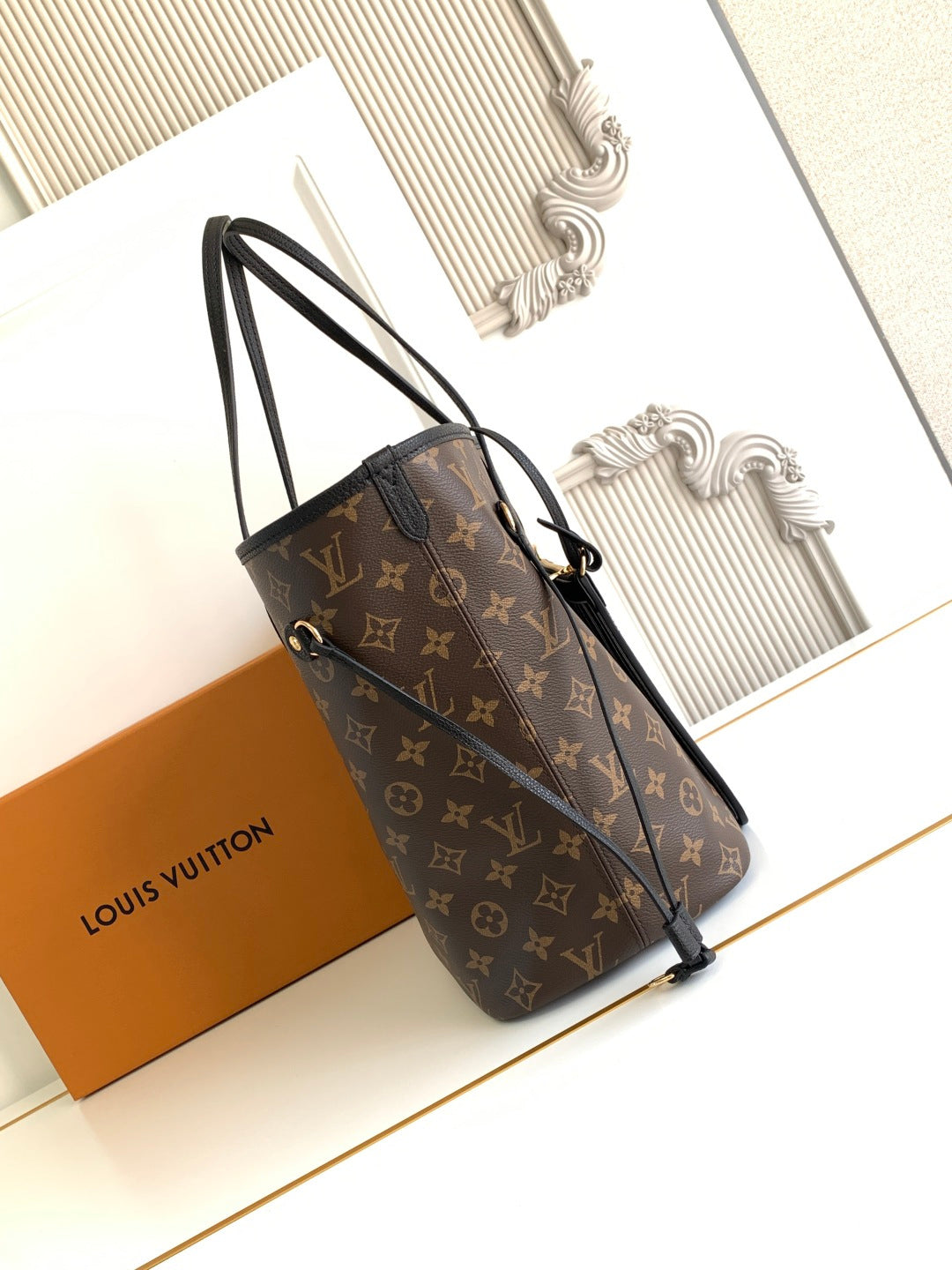 Louis Vuitton monogram shoulder tote bag with short handles and adjustable side straps
