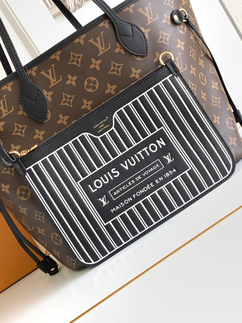 Louis Vuitton monogram crossbody bag with barcode panel and black leather details
