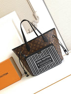 Louis Vuitton monogram tote bag with black handles and zip top; front barcode-style panel