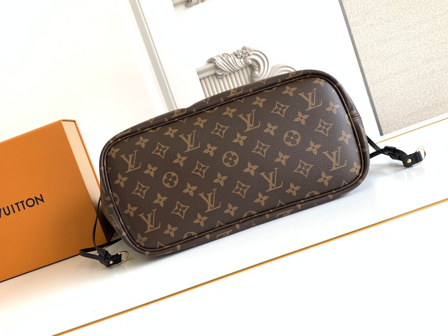 Louis Vuitton monogram crossbody bag with adjustable strap and curved zip top
