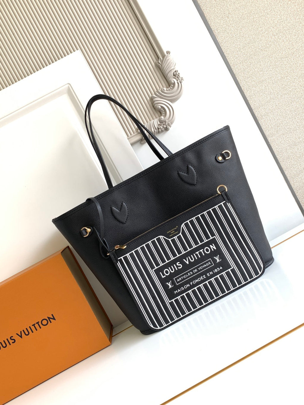Louis Vuitton black tote bag with barcode-style front panel and short top handles