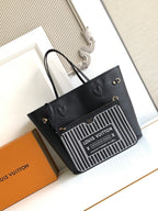 Louis Vuitton black tote bag with barcode-style front panel and short top handles