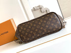 Brown monogram crossbody bag with rounded top and adjustable shoulder strap