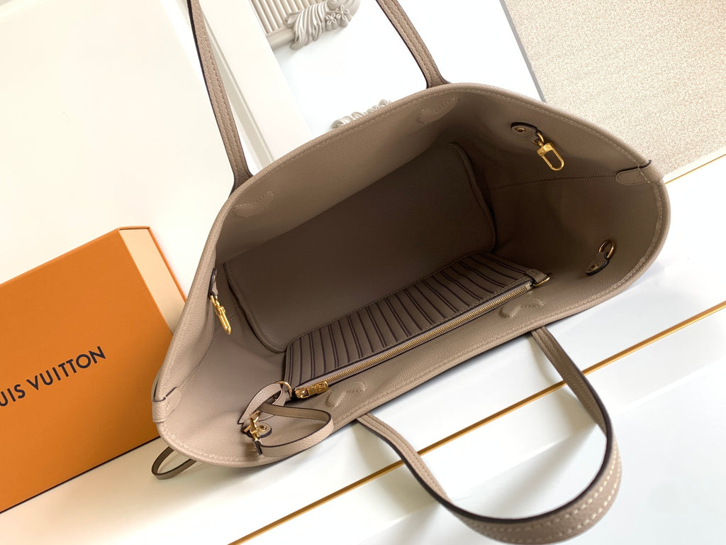 Beige tote bag with top zipper and fabric-lined interior, shown open