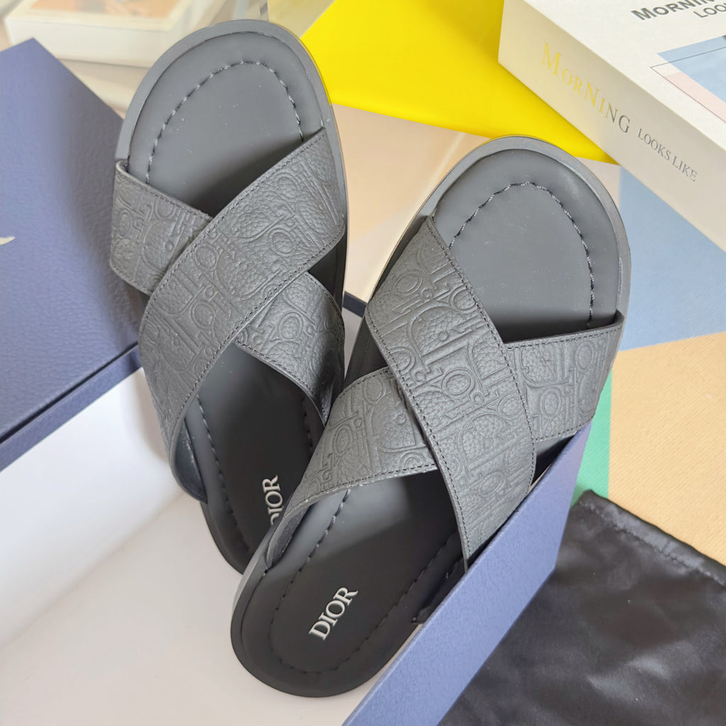 Dior unisex slide sandals in light gray with embossed wide straps and padded footbed