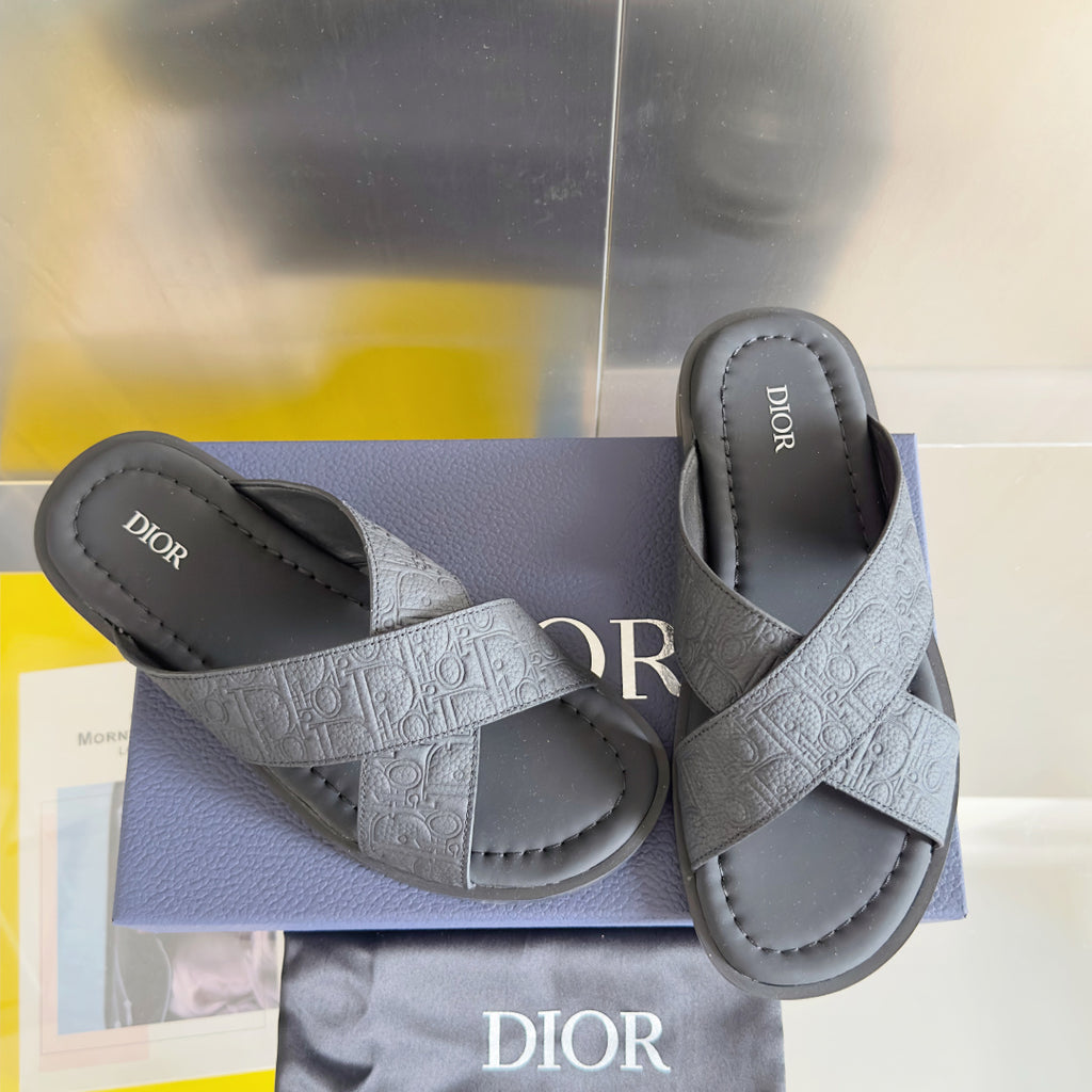 Dior unisex slide sandals in light gray with embossed straps and cushioned footbed