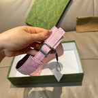 Pink Gucci visor cap strap end with GG monogram and metal buckle