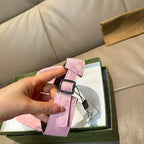 Pink Gucci visor cap strap detail with GG monogram and adjustable buckle
