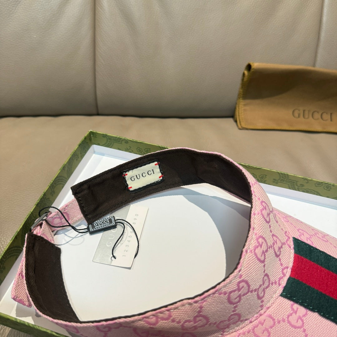 Pink Gucci visor cap interior with black lining and branded patch
