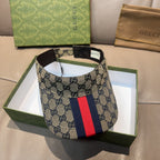 Gucci GG canvas cap with dark brim and red-blue web stripe front panel