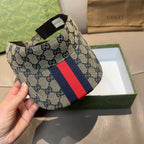 Gucci GG canvas cap with red-blue web stripe, angled side view
