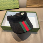 Gucci visor cap in dark fabric with GG pattern and green-red striped panel