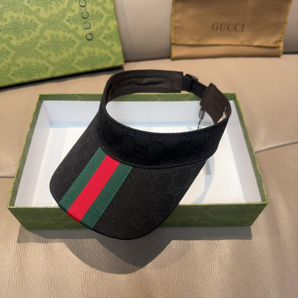 Gucci visor cap in dark GG fabric with green and red striped front panel