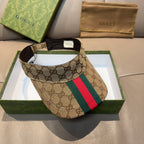 Gucci GG canvas visor cap with green and red web stripe, black interior