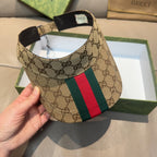 Gucci GG canvas visor cap with green and red web stripe, side view with black strap