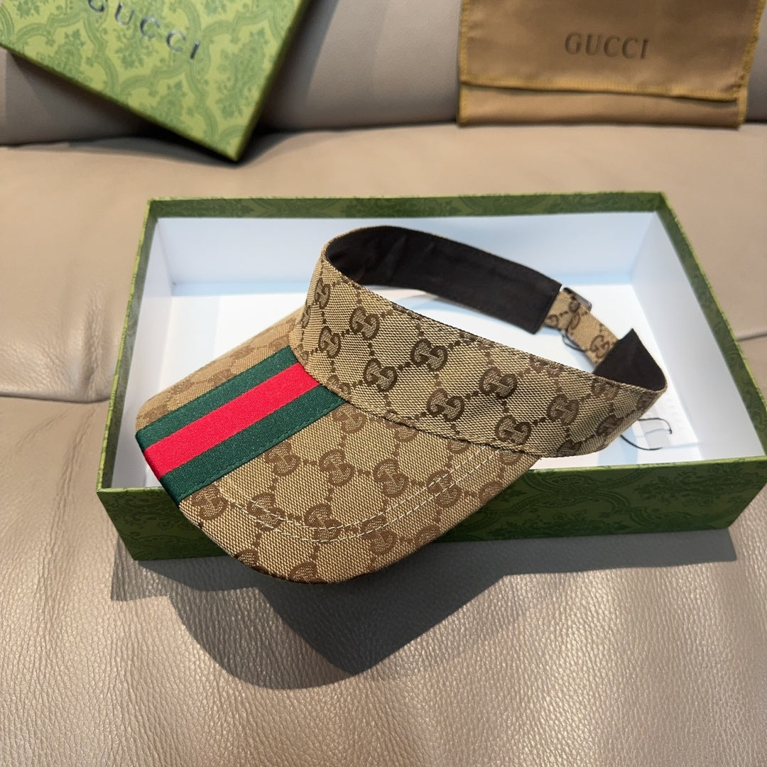 Gucci GG canvas visor cap with green and red web stripe, black adjustable strap