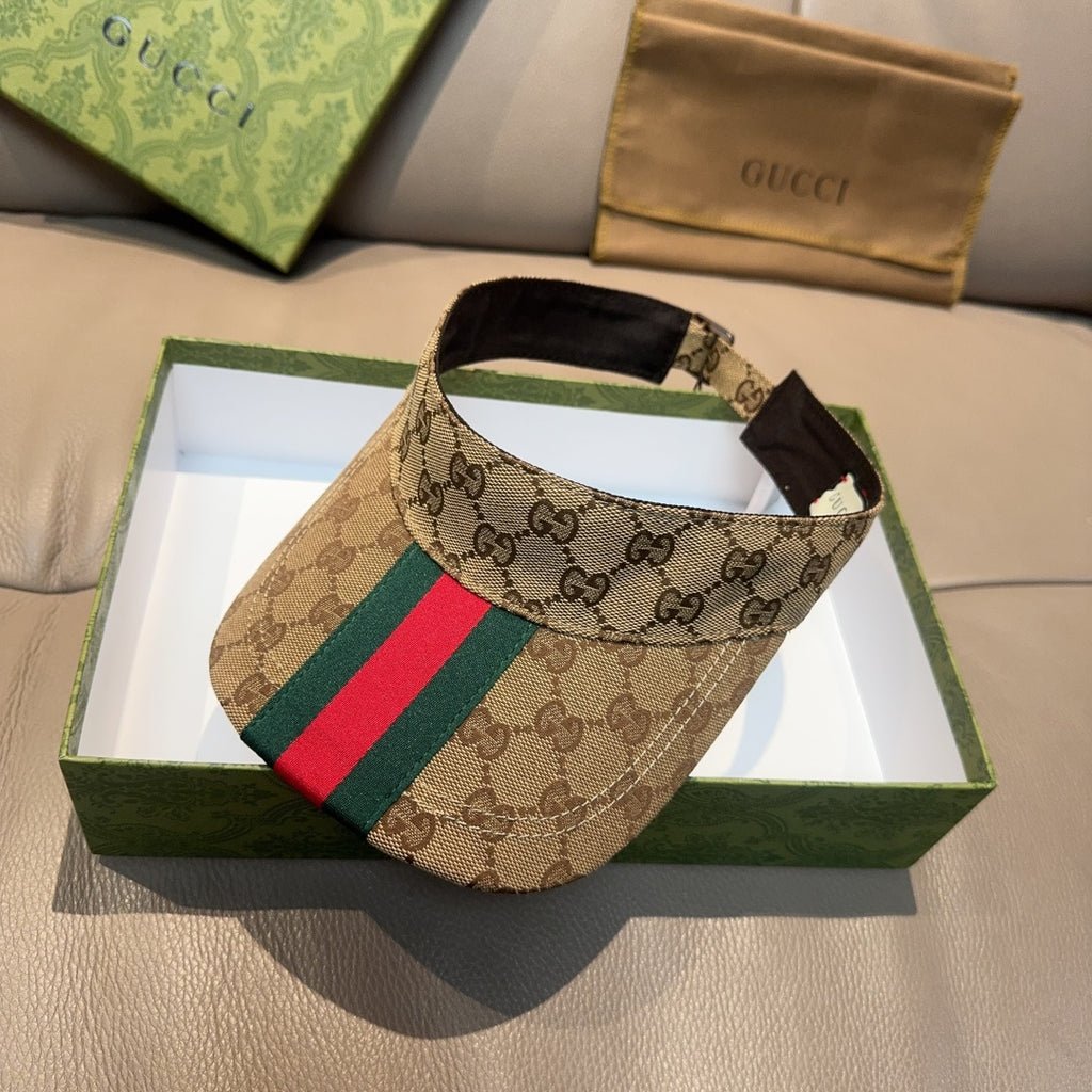 Gucci GG canvas visor cap with green and red web stripe, curved brim