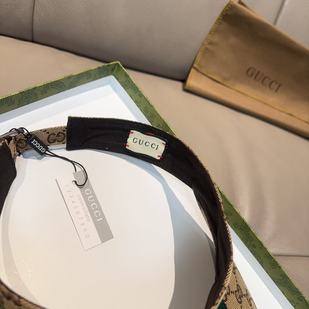 Gucci visor cap with black interior lining on GG canvas, green and red stripe