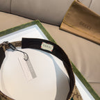 Gucci visor cap with black interior lining on GG canvas, green and red stripe