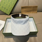White GG-print visor cap with brown inner band and adjustable strap