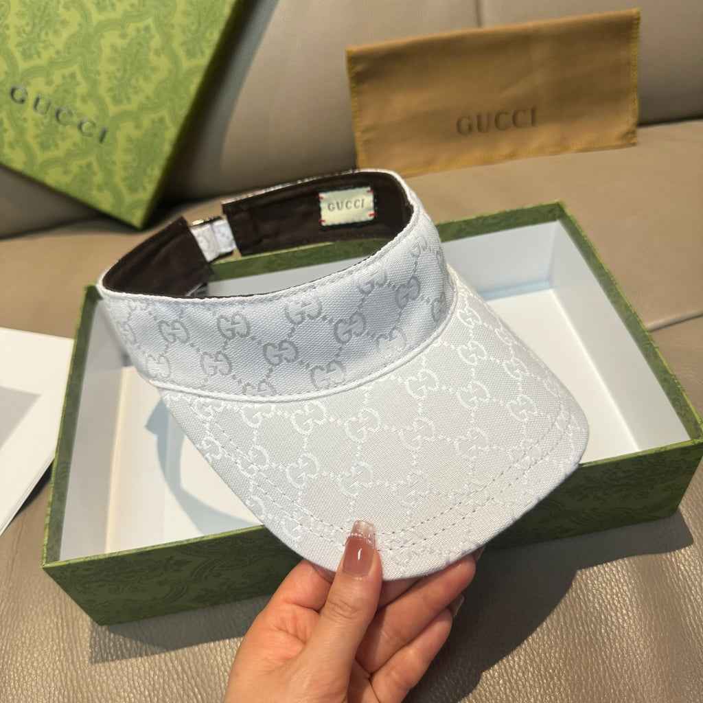 White GG-print visor cap front view with brown inner lining