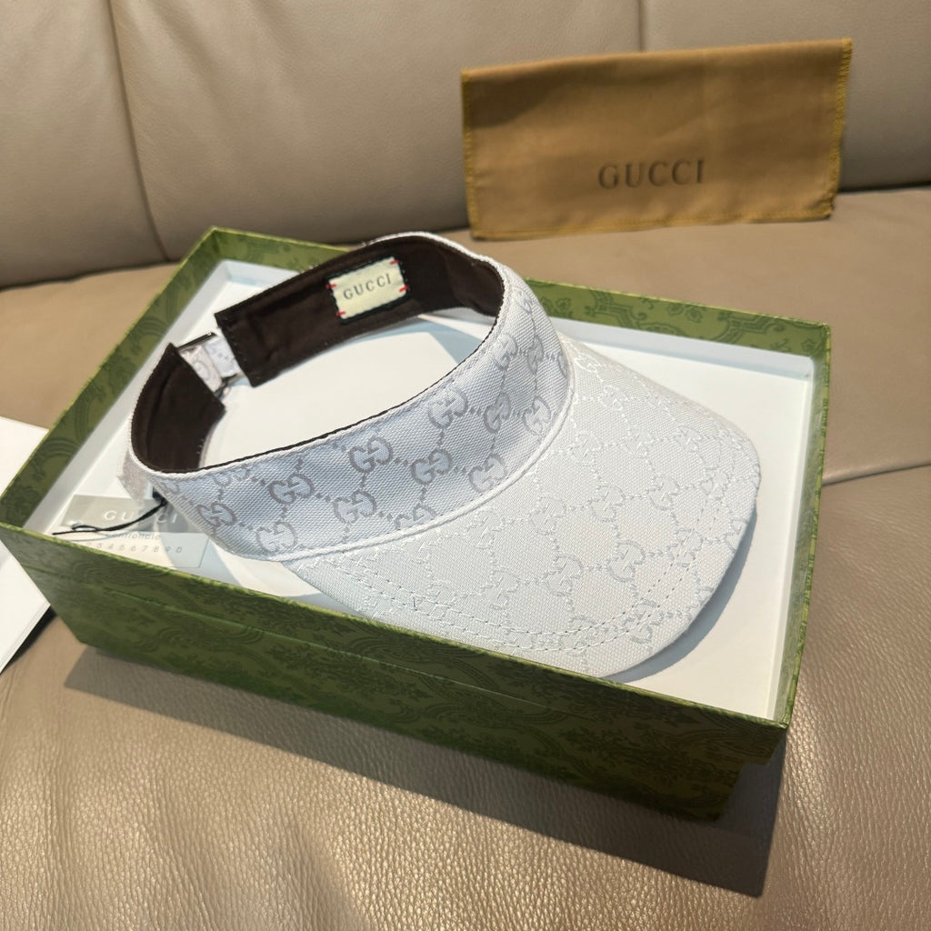 White GG-print visor cap with brown inner band visible