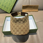 Brown GG monogram visor cap with black interior and adjustable strap