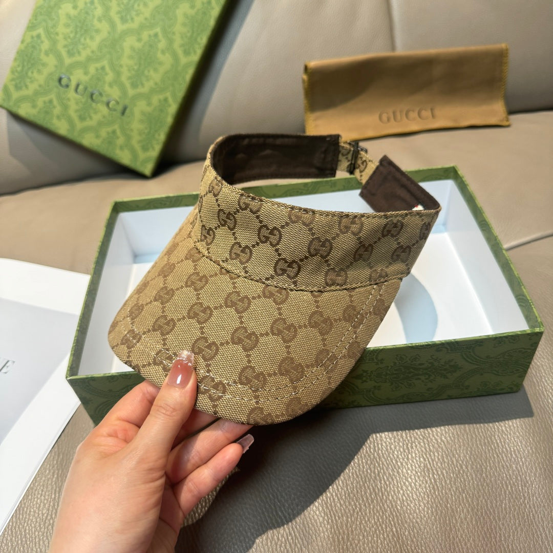 Brown GG monogram visor cap, front view with black interior lining